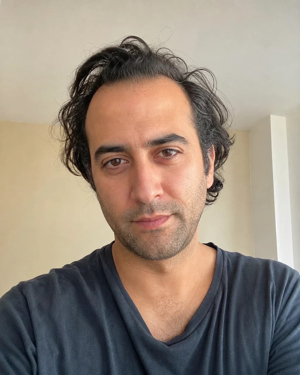 Fictional man with wavy hair and receding temple corners